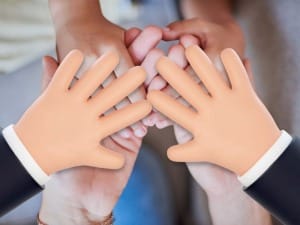 a picture of social care worker hands in the middle with a System C characters hands in the middle too.