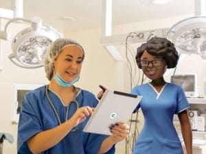 A picture of a healthcare professional viewing our CareFlow EPR (electronic patient record) brochure on an electronic device.