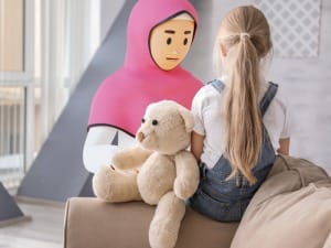 A System C character comforting a child.